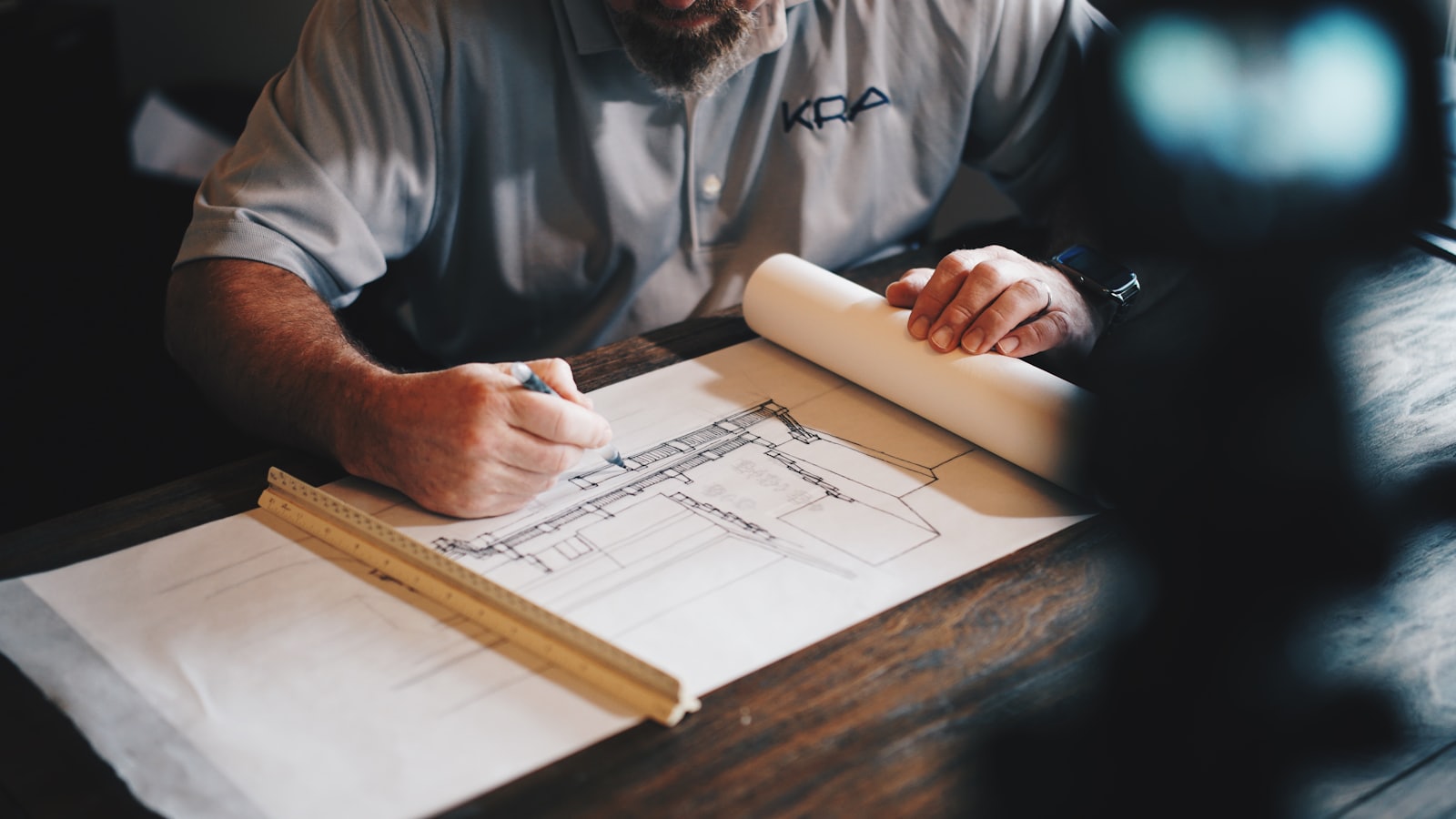 Architectural blueprint being reviewed