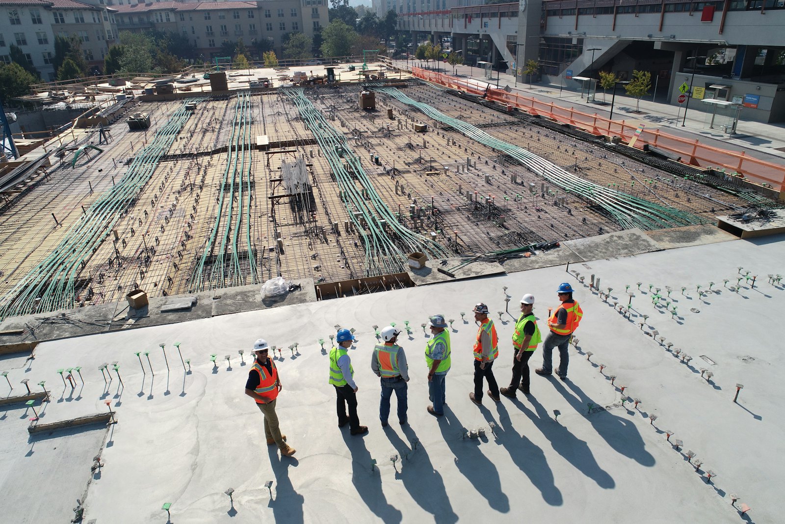 Construction site engineers reviewing a building foundation